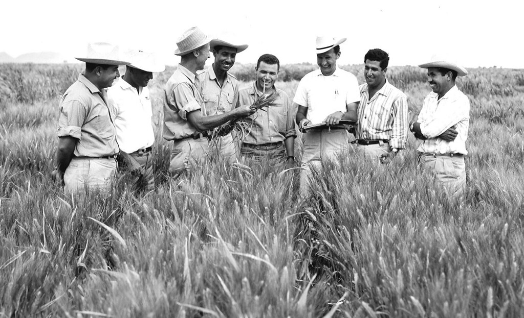 Dr.Norman Borlaug with people.